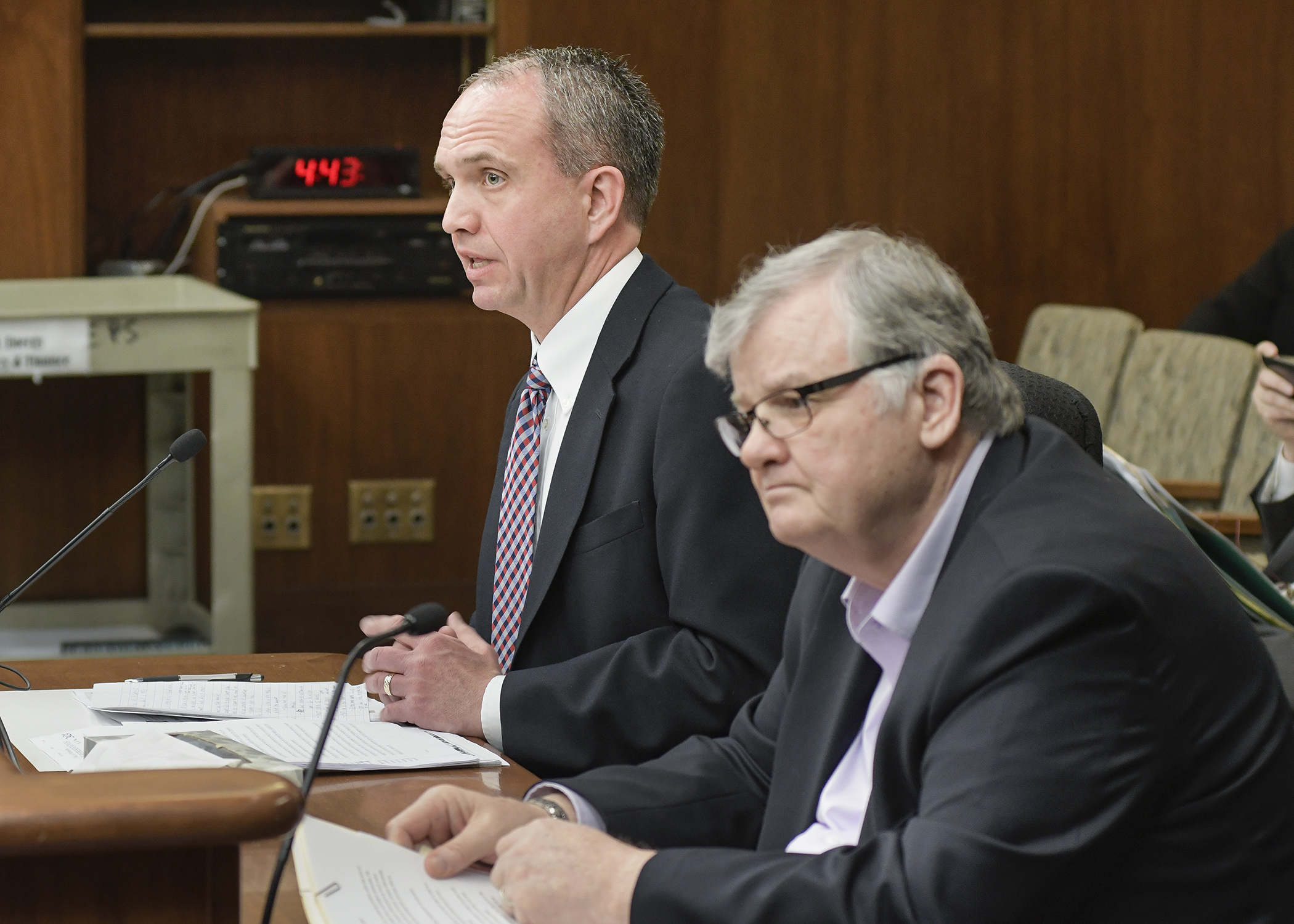 Scott Marquardt, vice president of the Southwest Initiative Foundation, testifies before the House jobs and energy committee April 11 in support of a bill sponsored by Rep Bob Gunther, right. Photo by Andrew VonBank